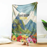 Blue tropical blanket with Saint Lucia The Pitons text, hibiscus and flowers border