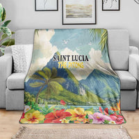 Hibiscus floral pitons blanket in blue, draped over sofa with printed Saint Lucia text