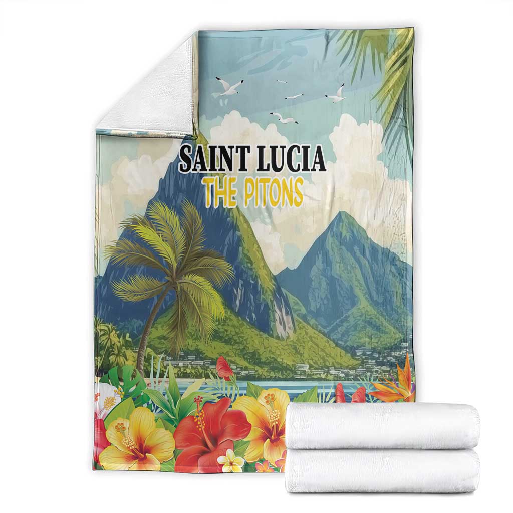 Blue tropical blanket set with Saint Lucia The Pitons print and hibiscus flowers, stacked towels