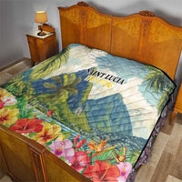 Saint Lucia quilt on bed with “SAINT LUCIA THE PITONS” text, tropical palms and hibiscus flowers
