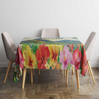 Tablecloth with vivid hibiscus and tropical foliage print across a blue-green base