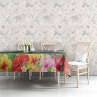 Tropical hibiscus tablecloth with colorful floral print on a green-blue background