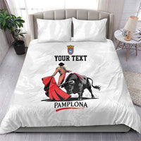 White duvet and pillowcases with bull and matador artwork and 'YOUR TEXT' text.