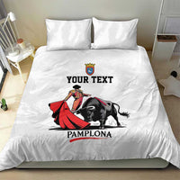 White bedding set with bull and matador graphic, 'YOUR TEXT' and 'PAMPLONA' text.