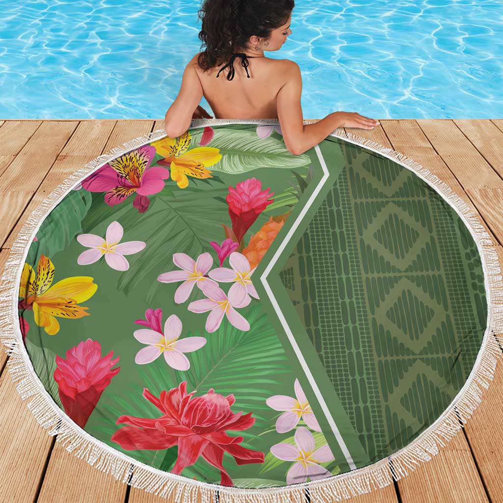 Round beach blanket with green geometric center and floral print, white fringe