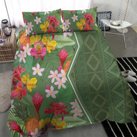 Green floral bedding set with mixed tropical flowers and a green geometric stripe panel