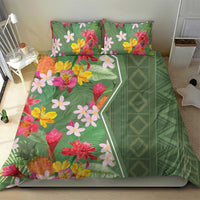 Green tropical bedding set with flower prints and a solid green geometric diamond panel