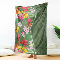 Green tropical flower blanket with multicolor blooms and patterned right-side panel