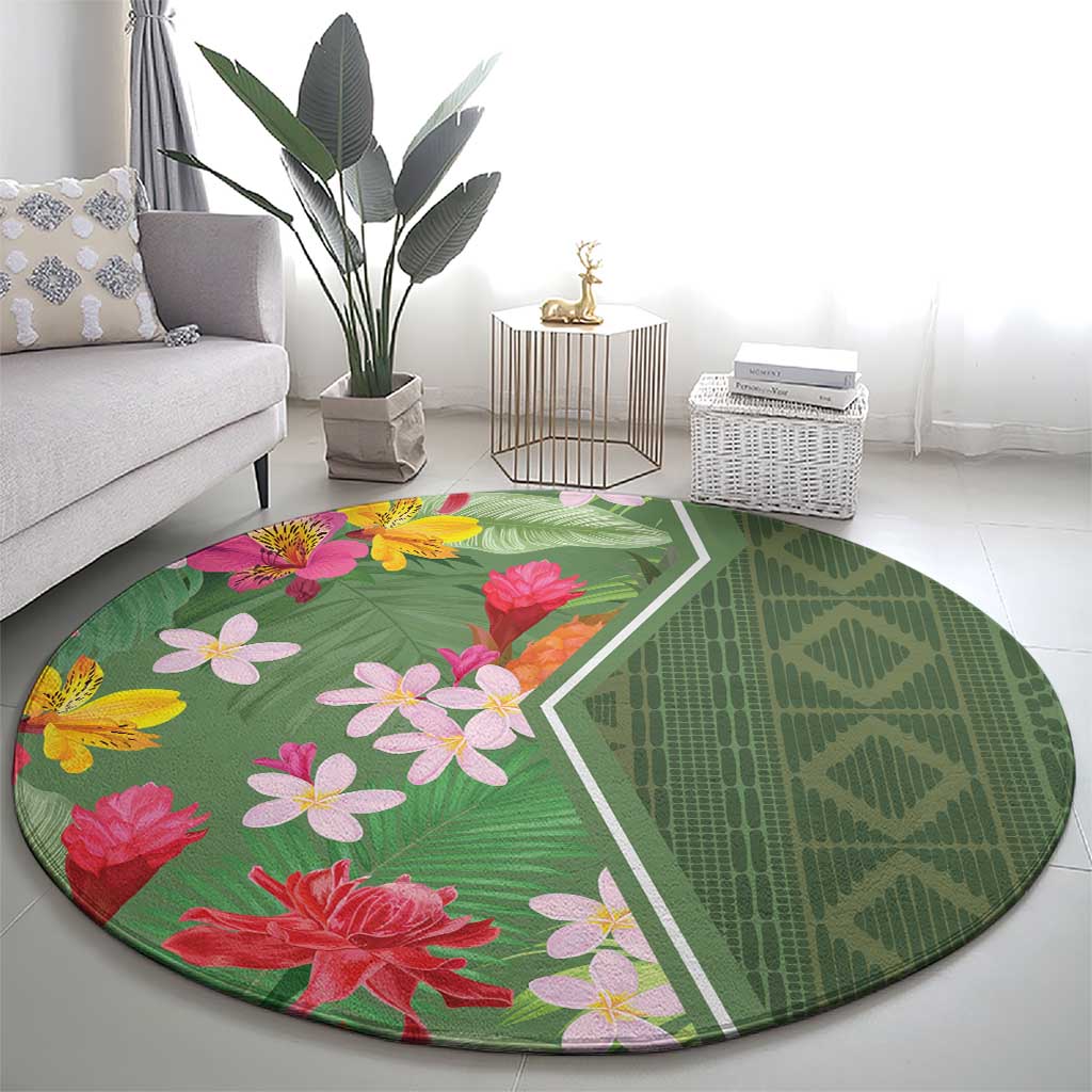 Round green tropical flower rug with leaf pattern and white edging, full view