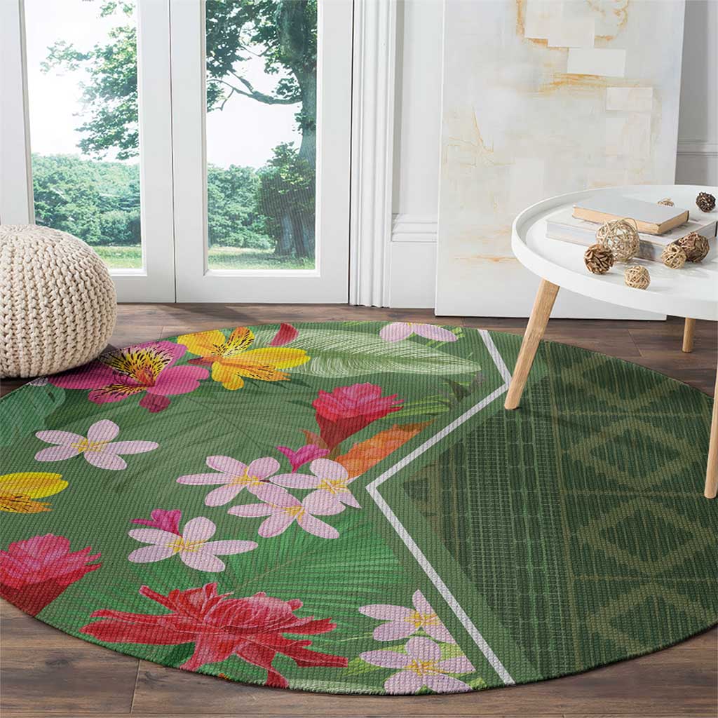 Round green floral round rug with pink and red flowers and white diamond border