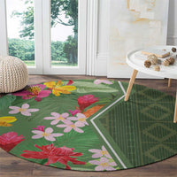 Round green floral round rug with pink and red flowers and white diamond border