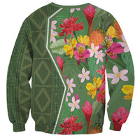 Unisex green sweatshirt, back view with bold tropical flowers and leaves print