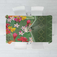 Green tropical floral tablecloth with geometric diamond pattern, corner crop