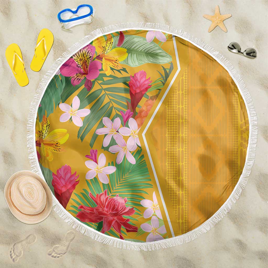 Round yellow beach blanket with tropical flowers and leafy print, white fringe edge