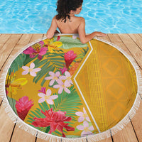 Round beach blanket with floral tropical center and yellow geometric back, fringed edge