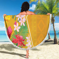 Round beach blanket with tropical flower print, yellow back panel, white tassel fringe