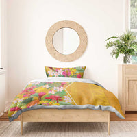 Yellow tropical floral bedding set on bed with two pillowcases and duvet cover print
