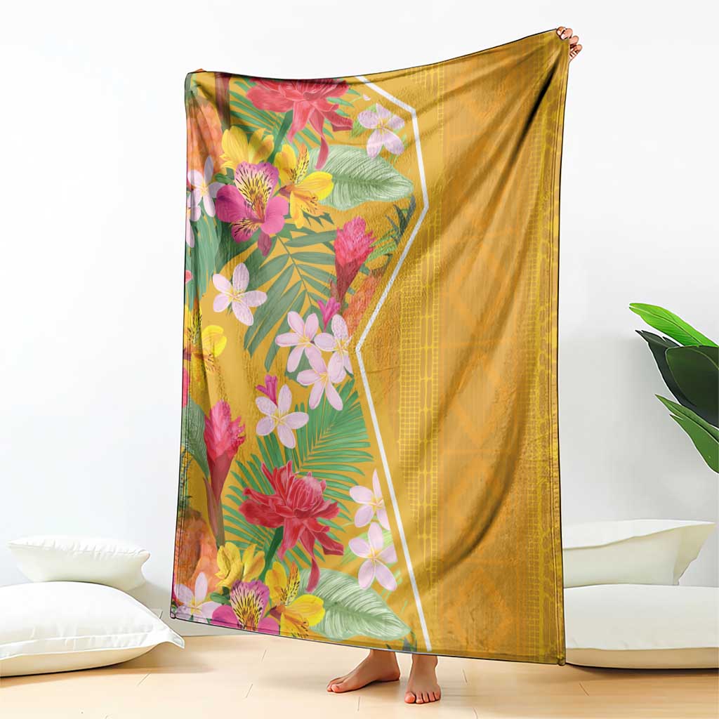 Yellow tropical flower blanket draped on sofa with colorful floral panel and back