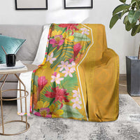Yellow tropical flower blanket on light rug, floral panel and solid yellow back
