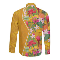 Yellow long-sleeve button shirt with tropical flowers and leaves, partial view of pattern