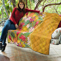 Yellow floral quilt with diamond stitching and bright tropical flower print, dark border