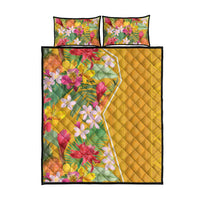 Yellow bed set with floral comforter panel and two square pillows, quilted diamond texture