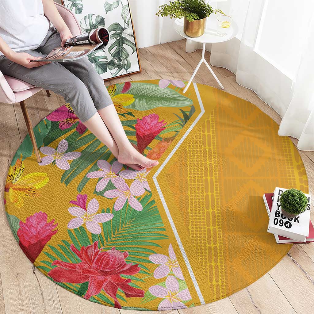 Yellow round carpet featuring pink and purple tropical flowers with green foliage, border