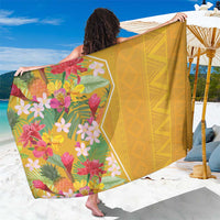 Yellow tropical floral sarong with green leaves and multicolor flower border