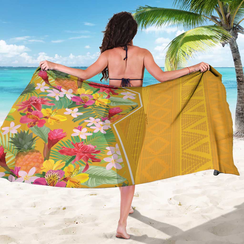 Yellow sarong with geometric trim and large pink, orange, and white flower print