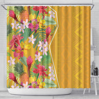 Yellow shower curtain featuring tropical flowers on left panel and solid yellow on right
