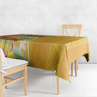 Yellow tablecloth with tropical floral print and geometric pattern drape on table
