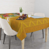 Yellow geometric tablecloth with tropical floral edge draped over dining table