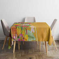 Yellow and multicolor tropical flower tablecloth covering dining table