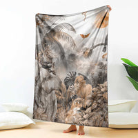 Grey safari animal throw blanket draped on floor with elephants, lions, and birds print