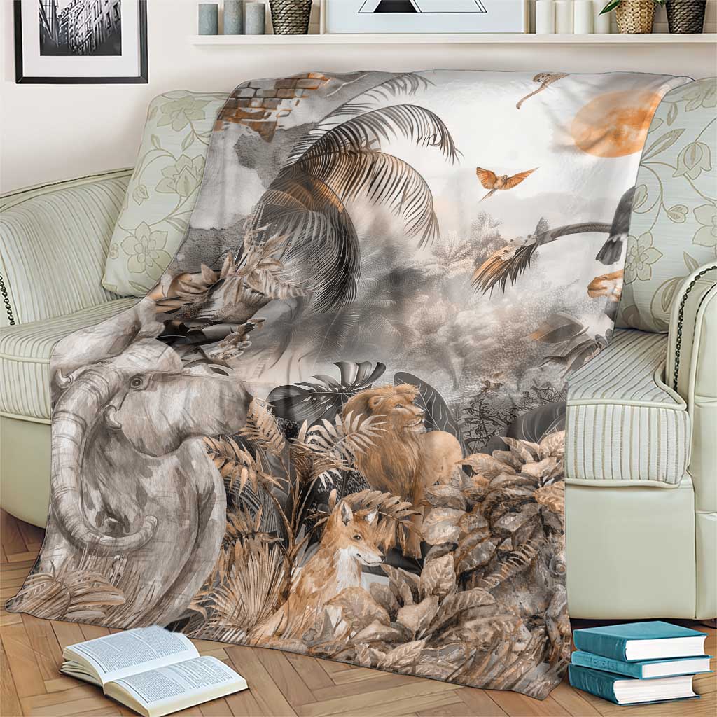 Grey safari animal throw blanket on couch with elephant, lion, birds, and tropical foliage