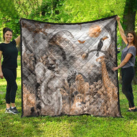 Grey safari animal quilt with quilted diamond stitching, draped flat outdoors