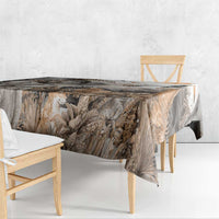 Grey safari animal tablecloth draped over table with jungle leaves and wildlife