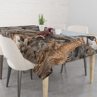 Grey safari animal tablecloth covering dining table with birds and elephant details