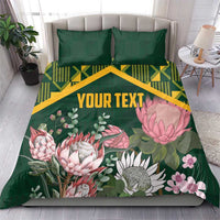 Green personalized duvet cover set with pillow shams, yellow kente pattern and pink protea florals, 'YOUR TEXT'