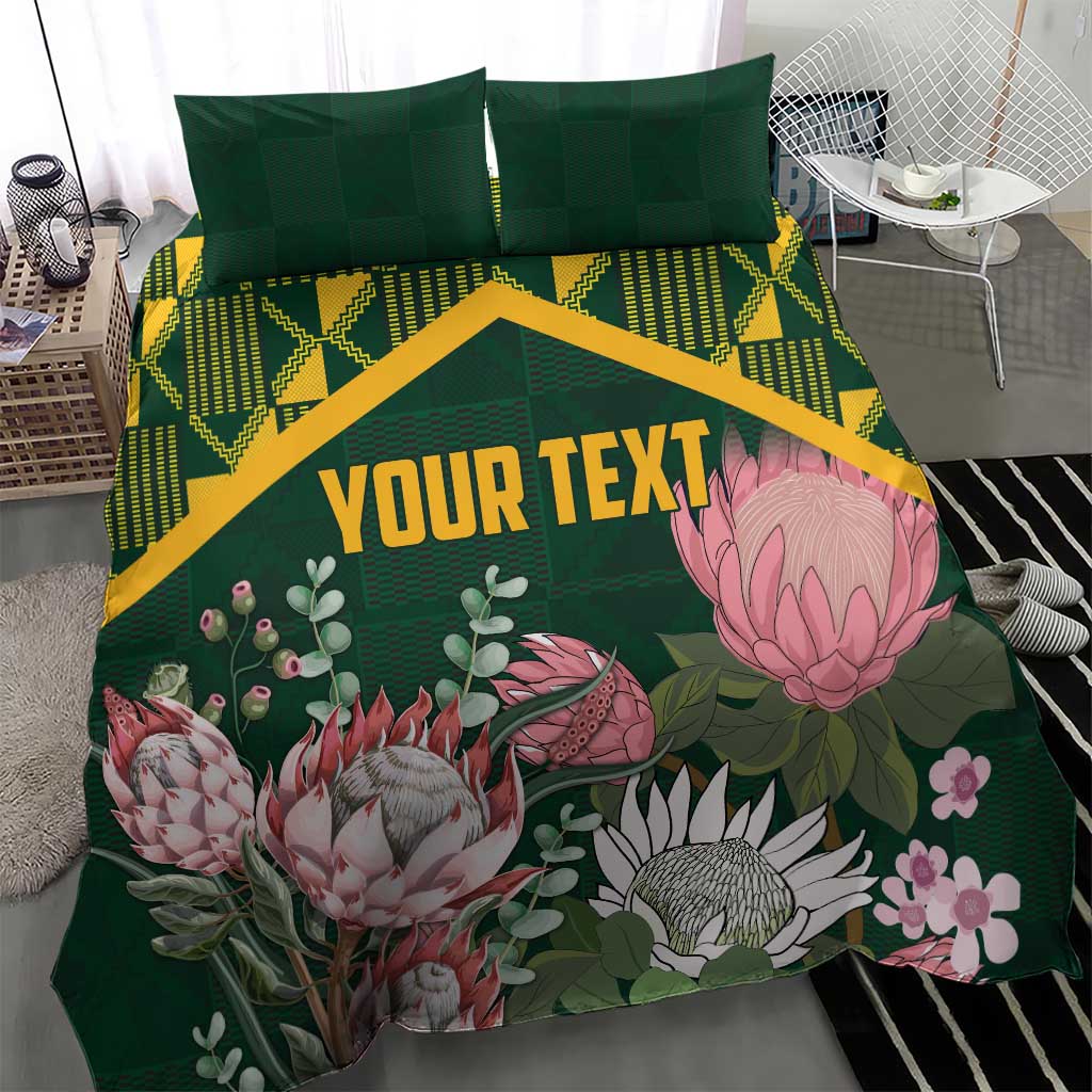 Green personalized duvet cover set with yellow kente chevron pattern and pink protea florals, 'YOUR TEXT'