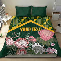 Green personalized duvet cover set with yellow kente pattern and pink protea florals, 'YOUR TEXT'