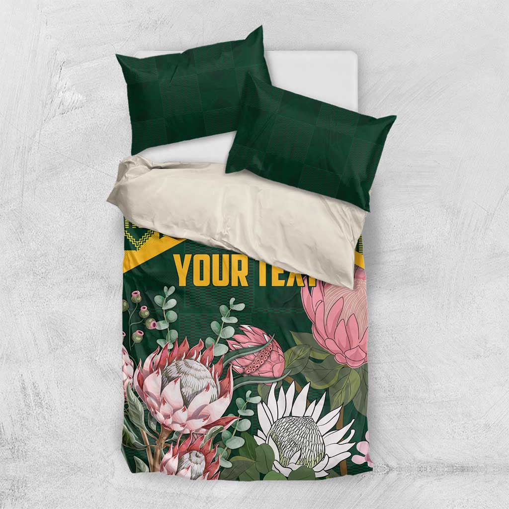 Green personalized duvet cover with yellow kente pattern and pink protea florals, 'YOUR TEXT'