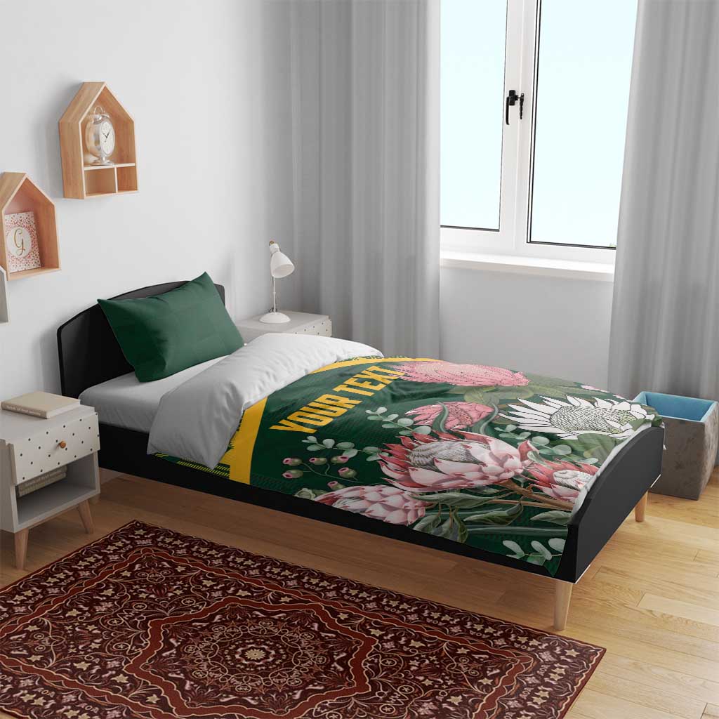 Green personalized duvet cover set with yellow kente pattern and pink protea florals, 'YOUR TEXT'