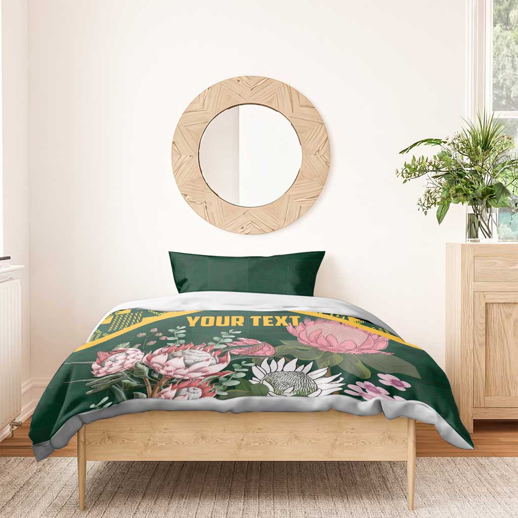 Green personalized duvet cover set with yellow kente pattern and pink protea florals, 'YOUR TEXT'