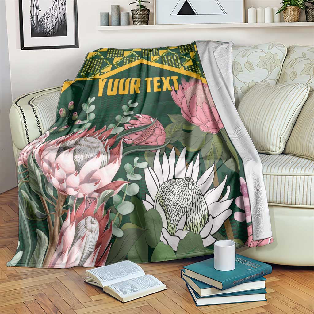 Personalized green king-size blanket with kente pattern border and protea floral print