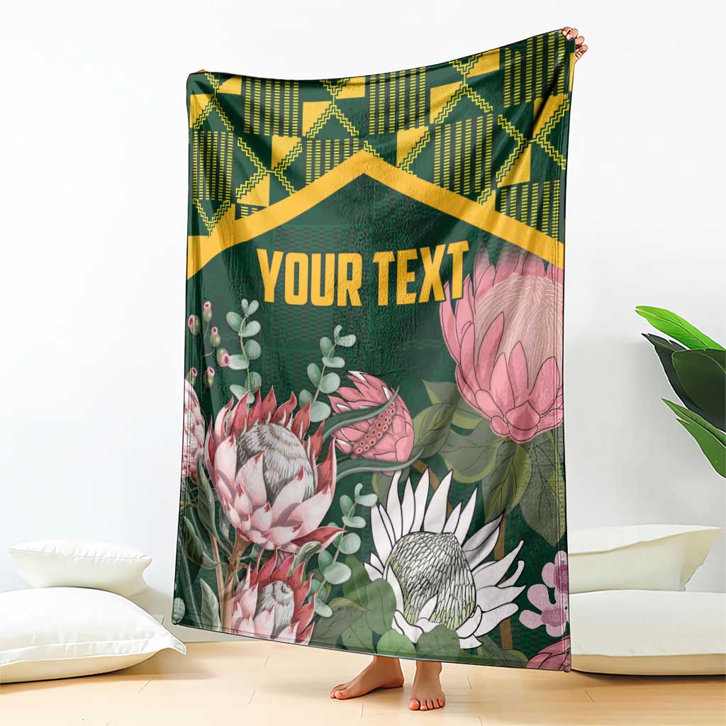 Personalized green blanket with kente-style zigzag band and large protea flower artwork