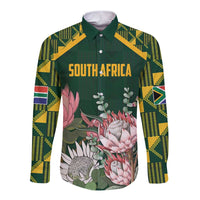 Green long sleeve button shirt, kente sleeve panels, floral front text "SOUTH AFRICA"