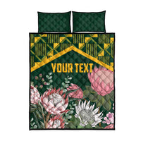 Green and yellow quilt bed set with floral protea design and two dark green pillows, “YOUR TEXT”