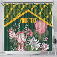 Green shower curtain with kente geometric top band, protea flowers, and "YOUR TEXT"