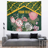 Green protea floral wall tapestry with kente-style geometric border and centered text area